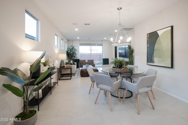 dining area featuring a chandelier, recessed lighting, visible vents, and baseboards