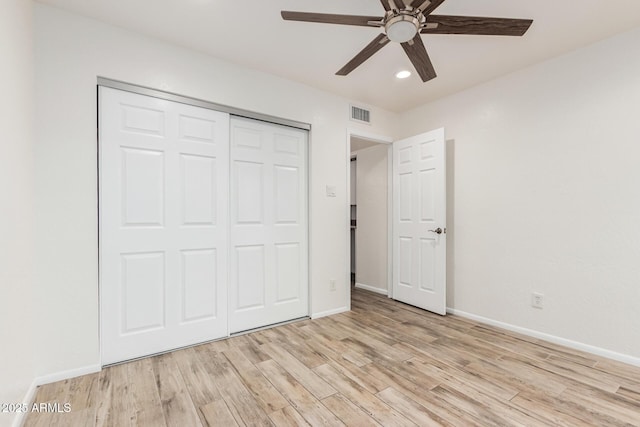 unfurnished bedroom with visible vents, baseboards, light wood-style flooring, a closet, and recessed lighting