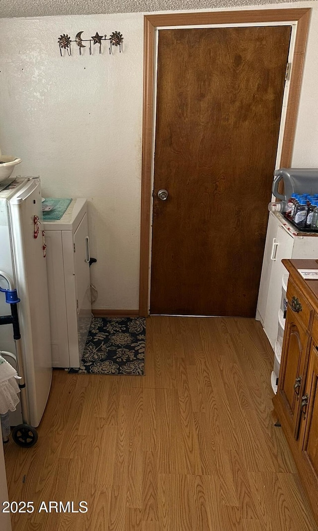 633 E 7th St, Douglas, AZ 85607 - laundry area with laundry area, washer / clothes dryer, and light wood-type flooring