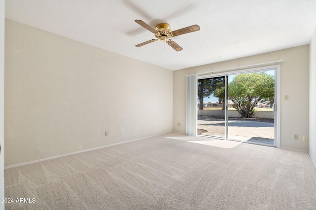 carpeted empty room with ceiling fan