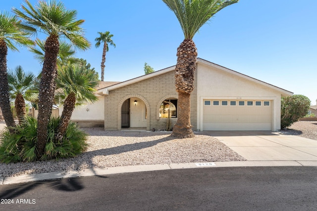 ranch-style house featuring a garage