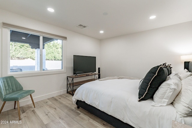 bedroom with light hardwood / wood-style flooring