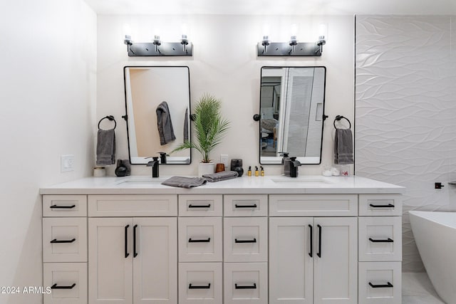 bathroom with vanity and a bathtub