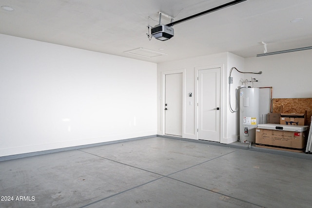 garage with electric water heater and a garage door opener