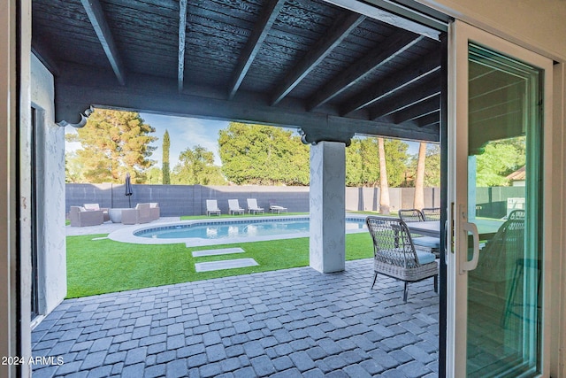 view of patio / terrace with a fenced in pool and outdoor lounge area