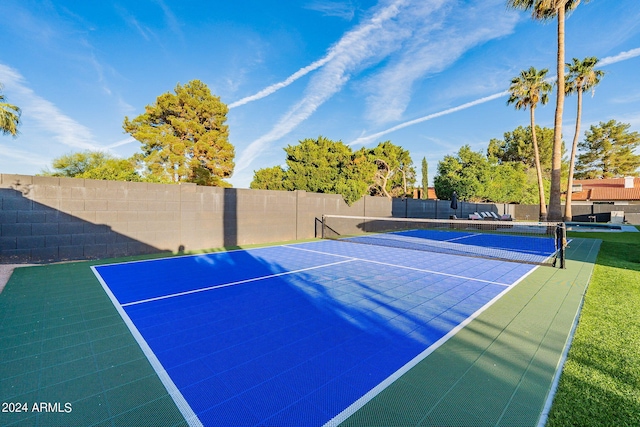 view of sport court with basketball hoop