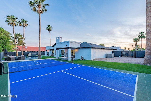 view of sport court with basketball hoop