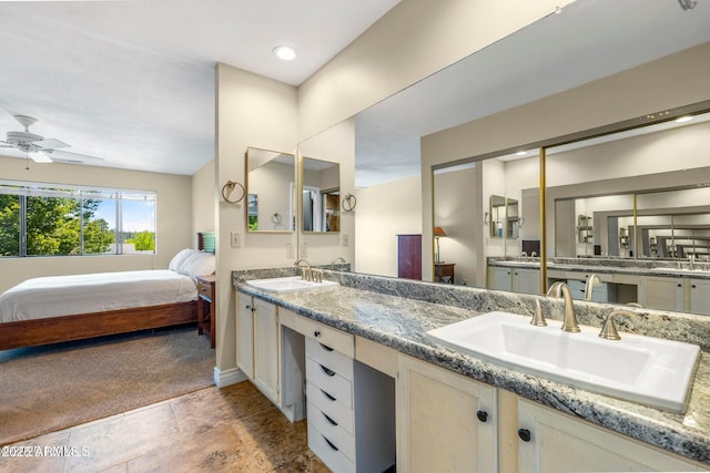2800 N Saddleback Way Unit 2, Flagstaff, AZ 86004 - bathroom with a ceiling fan, double vanity, ensuite bathroom, and a sink
