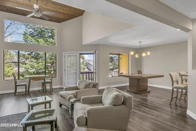 2800 N Saddleback Way Unit 2, Flagstaff, AZ 86004 - living room with dark wood-style flooring, ceiling fan, a towering ceiling, and baseboards