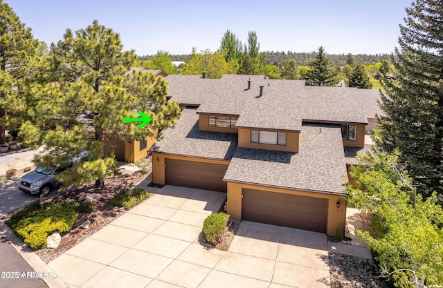 2800 N Saddleback Way Unit 2, Flagstaff, AZ 86004 - view of front of property with driveway, roof with shingles, and a garage