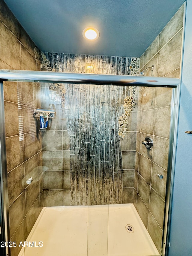 full bath featuring a stall shower