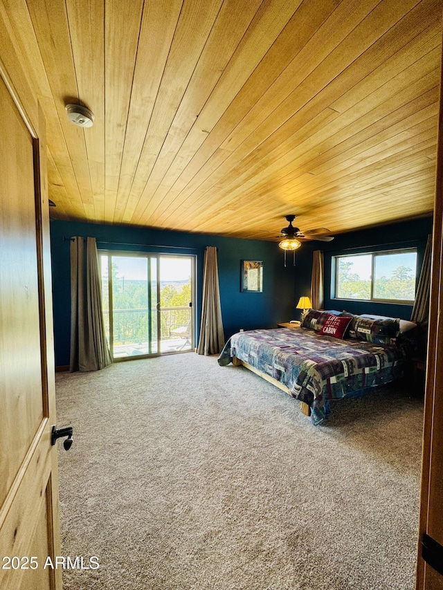 carpeted bedroom featuring ceiling fan and wooden ceiling