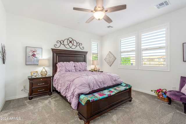 bedroom featuring light carpet and ceiling fan