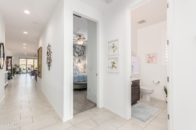 hallway featuring light tile patterned flooring