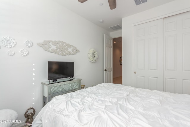 bedroom with ceiling fan and a closet