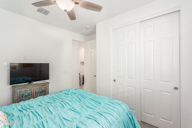 bedroom with ceiling fan, a closet, and carpet