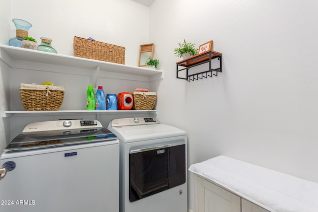 laundry area with separate washer and dryer