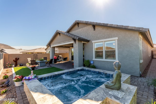 rear view of house with a patio area