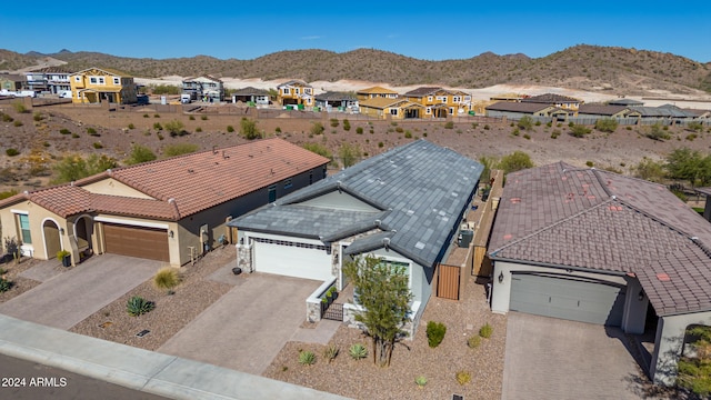 birds eye view of property featuring a mountain view