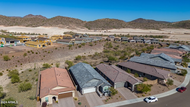 birds eye view of property with a mountain view