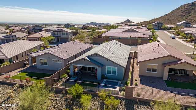 birds eye view of property featuring a mountain view