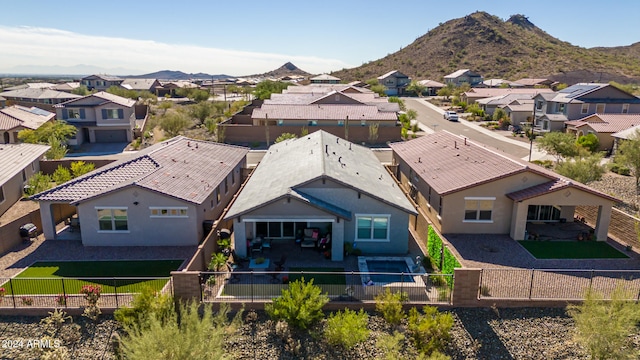 birds eye view of property with a mountain view