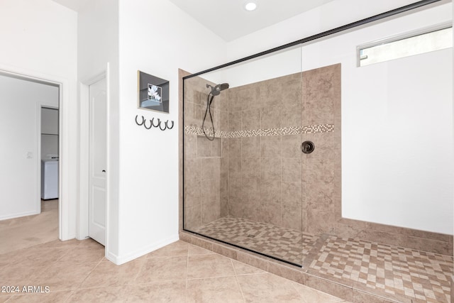 bathroom with tile patterned floors and walk in shower