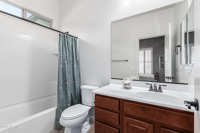 full bathroom featuring shower / tub combo, vanity, and toilet