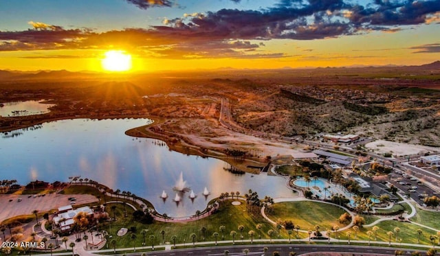 aerial view at dusk with a water view