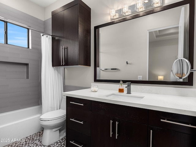 bathroom featuring toilet, vanity, and shower / tub combo with curtain