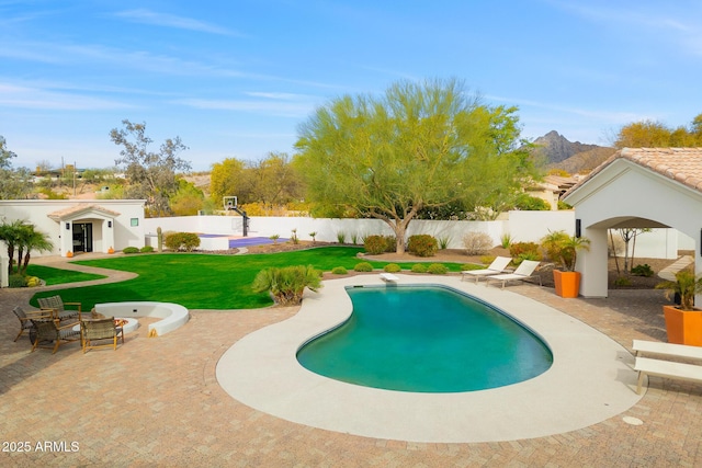 view of pool featuring a fenced in pool, a patio area, a mountain view, a fenced backyard, and a diving board