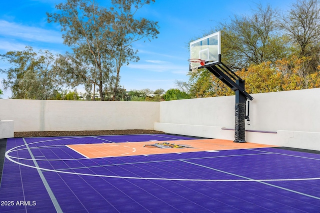 view of basketball court with basketball court and fence