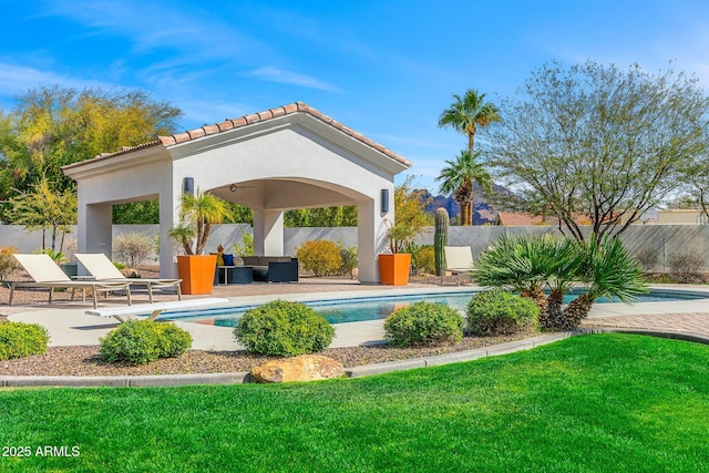 view of pool with a fenced in pool, a patio area, fence, and a lawn