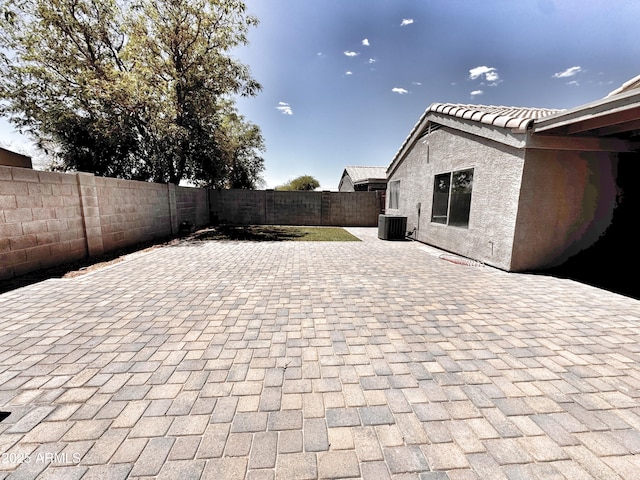 view of patio with central AC and a fenced backyard