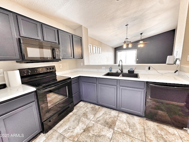 kitchen featuring black appliances, a sink, lofted ceiling, ceiling fan, and gray cabinetry