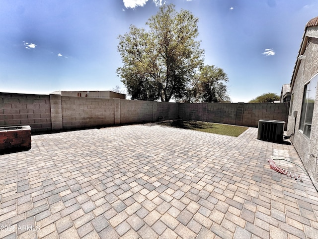view of patio with central AC and a fenced backyard