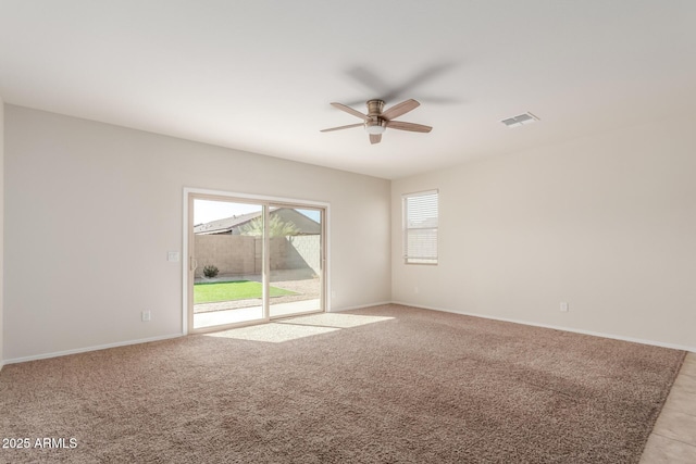 unfurnished room with ceiling fan and light carpet