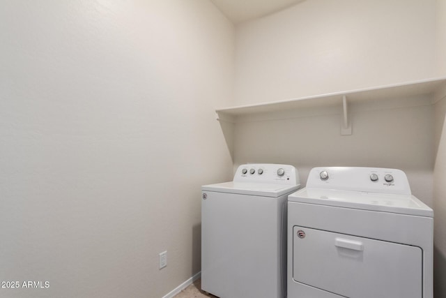 washroom with washing machine and dryer