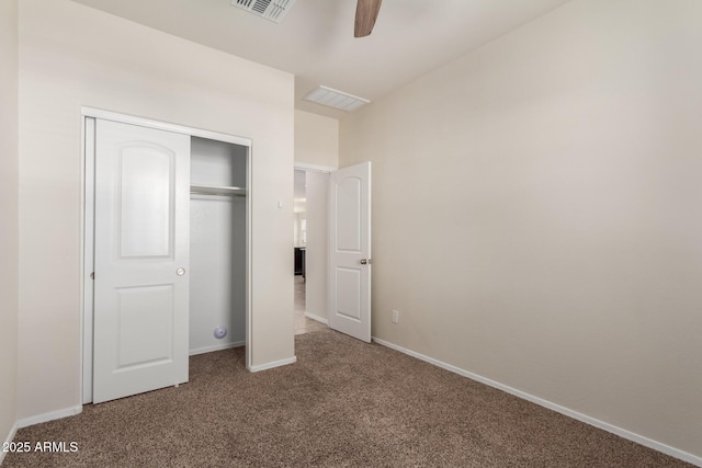 unfurnished bedroom with a closet, carpet flooring, and ceiling fan