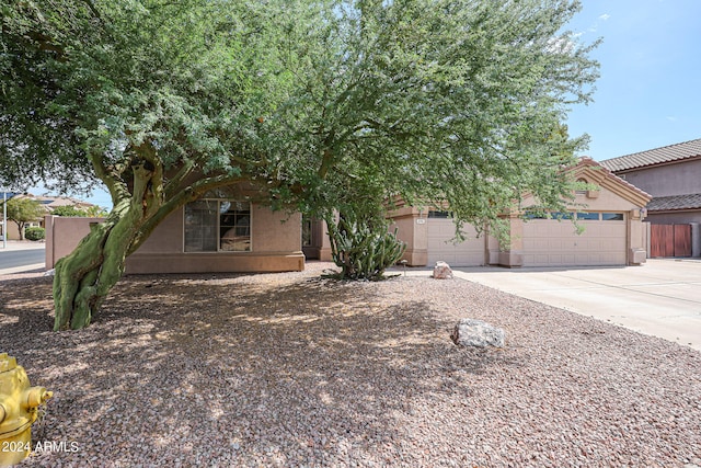 obstructed view of property featuring a garage