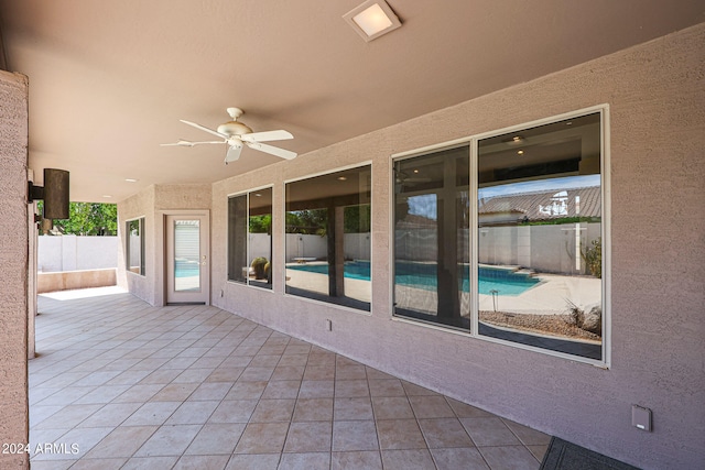 view of patio featuring ceiling fan