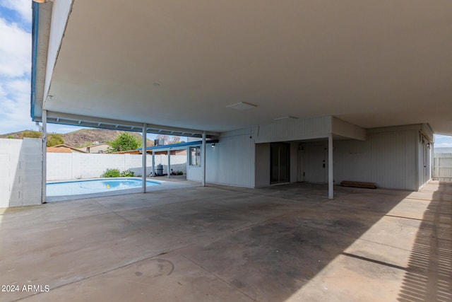 interior space featuring a fenced in pool and fence