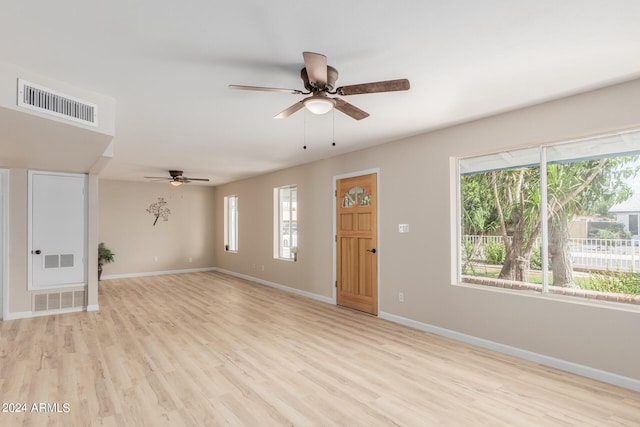 foyer featuring ceiling fan and light wood-type flooring