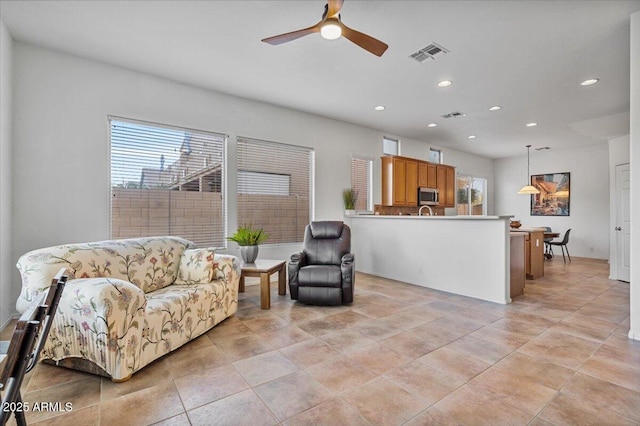 living room with ceiling fan