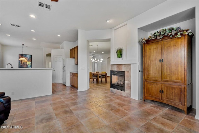 living room featuring a fireplace and a notable chandelier