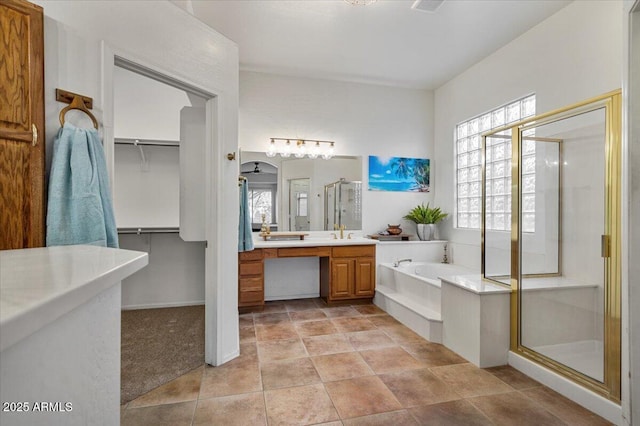 bathroom featuring vanity and separate shower and tub