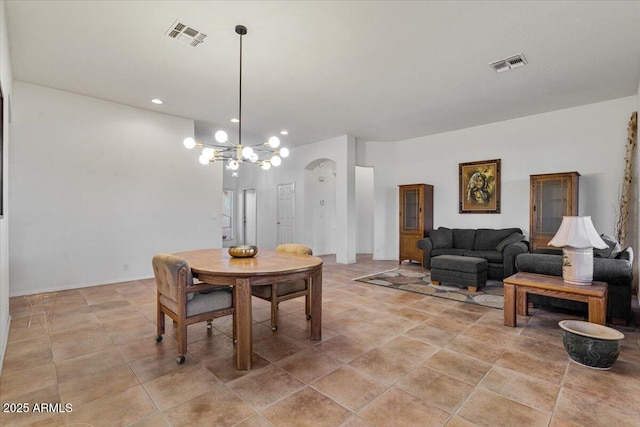 dining area featuring a notable chandelier