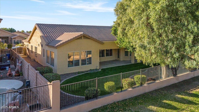 exterior space featuring a yard and a patio