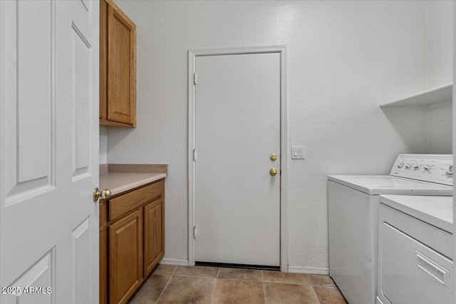 washroom with cabinets and independent washer and dryer