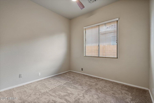 carpeted empty room with ceiling fan and lofted ceiling